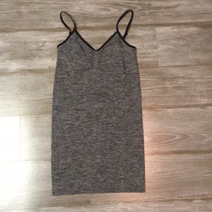 gray tank top with black straps.